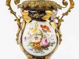 a large vase with a floral design on it