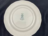 a white plate with a green design on it