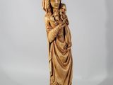 an image of a statue of a woman holding a cat