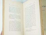 a person holding an open book in their hand