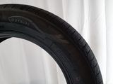 a close up of a tire on a table with a white background