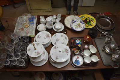 a table with a lot of dishes and cups on it