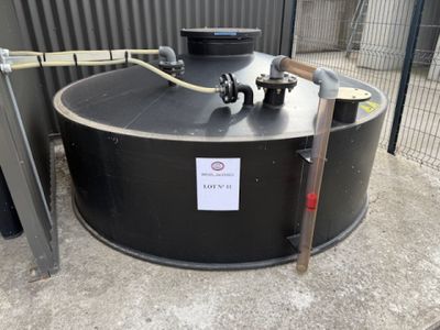 an image of a large black tank with a sign on the side of it