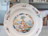 a plate that has a picture of a woman on it