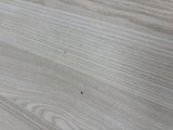 a close up of a wooden table with a knife and fork on it