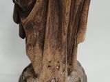an image of a statue of a man with a hat and a robe
