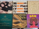 many books that are sitting on top of a table