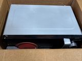 a box with a laptop inside of it sitting on the floor