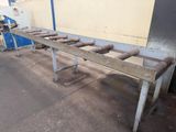 a long table that has a bunch of pipes on it