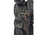 an image of a statue of a man with a cat on his back