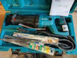 a blue box with tools inside of it on the floor