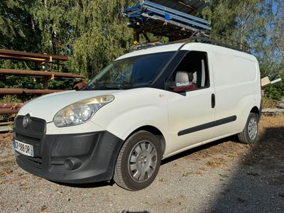 a white van that is parked on the side of the road
