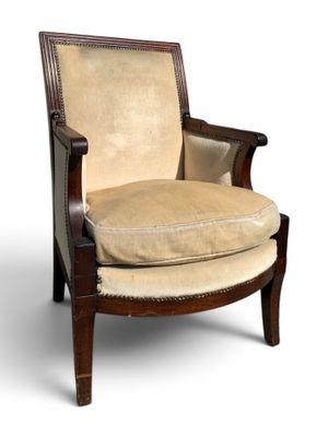 an upholstered chair with a beige upholstered seat and wood frame
