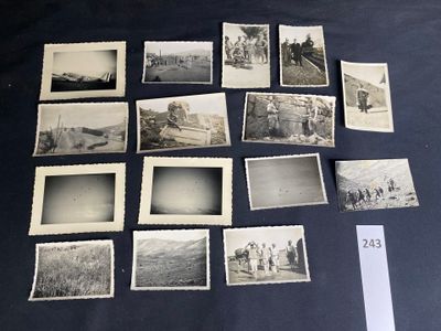 several old black and white photos of people and vehicles on a table