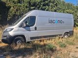 a silver van that is parked in the grass