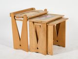 two wooden tables that are sitting next to each other