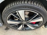 the tire of a car with a flat tire on the ground