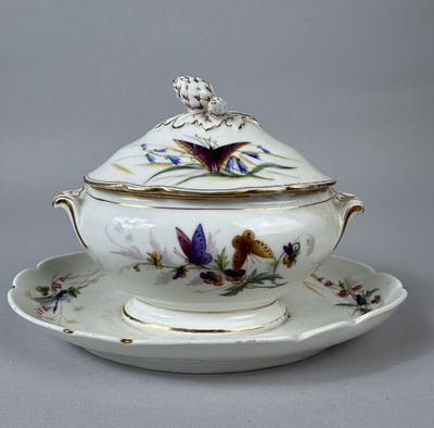 an image of a tureeny dish with a butterfly on it