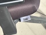 a sticker on the seat of an office chair