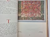 an open book with a picture of a rug on it