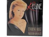 the cover of a magazine with a picture of a woman in a black dress