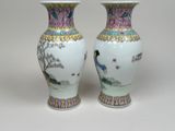 two vases that are sitting on a table