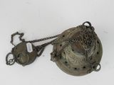 an old brass bell with chains and a chain hanging from it