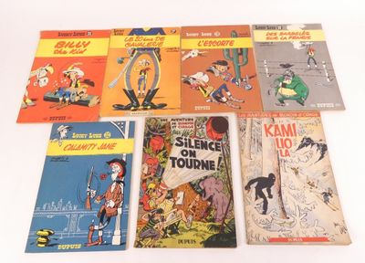 Plusieurs bandes dessinées pour enfants sont alignées sur une surface blanche