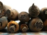 a pile of nuts on a table with a white background