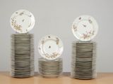 many plates stacked on top of each other on a table