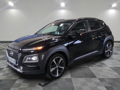 a black 2020 hyundai kona suv parked in a garage
