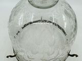 a glass jar with a lid on a white surface