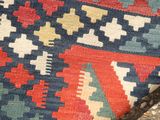 a close up view of a colorful rug on the ground