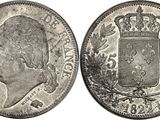 a silver coin with a crown on the front and a crown on the back
