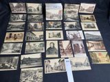 an old photo of a bunch of old postcards on a table