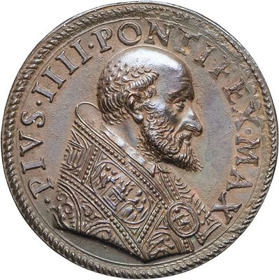 an old coin with a man ' s face and a crown on it