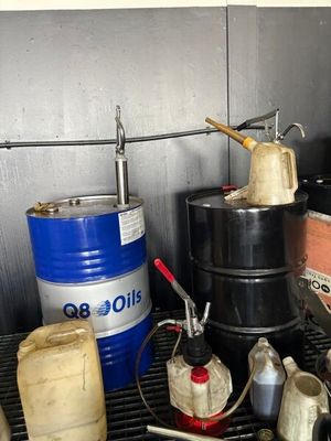 many different types of oil in a metal container