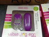 packaging of a purple nail polish and a purple manicure