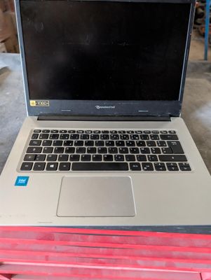 a laptop computer sitting on top of a red box