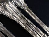 a lot of spoons that are sitting on a table