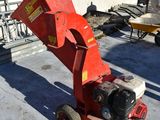 a red machine that is sitting on top of a building