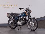 a motorcycle that is parked in front of a wall