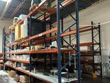 a large warehouse with a lot of shelves and pallets