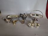 silver plated items on a white surface with a red background