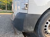 a close up of a truck with a tire on the road