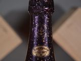 a close up of a bottle of wine on a table