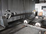 a machine that is working on a piece of metal