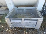 a plastic crate that is sitting on the ground