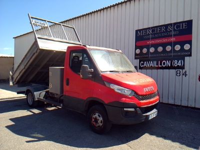 a red truck that is parked in front of a building
