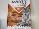 a bag of wolf wilderness soft dog food sitting on top of a counter
